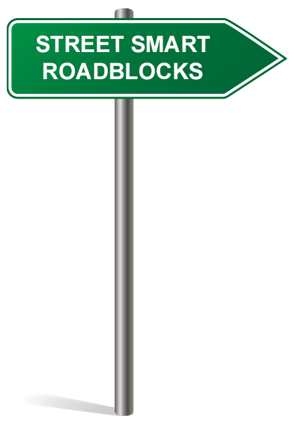 A green directional road sign on a pole with the words "STREET SMART ROADBLOCKS" in white capital letters.
